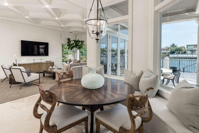 620 Golden Harbour Drive Boca Raton, FL 33432 - Photo 20 of 45 a view of a dining room with furniture and wooden floor