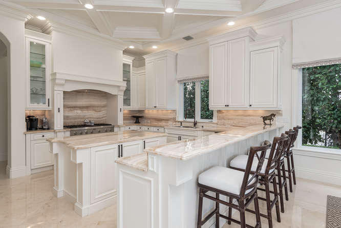 620 Golden Harbour Drive Boca Raton, FL 33432 - Photo 23 of 45 a kitchen with stainless steel appliances granite countertop a sink and a refrigerator