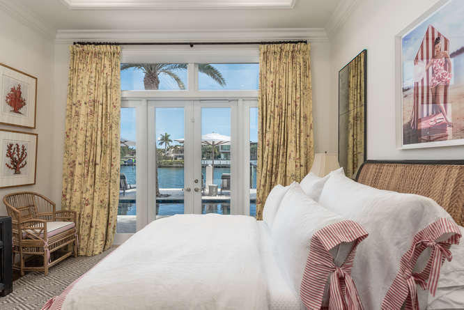 620 Golden Harbour Drive Boca Raton, FL 33432 - Photo 30 of 45 a bedroom with a bed and a window