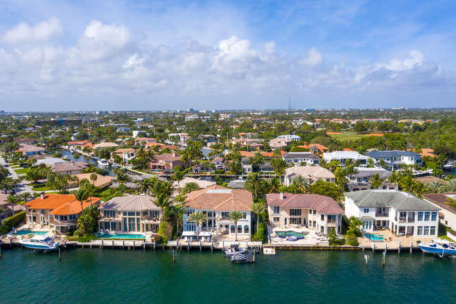 620 Golden Harbour Drive Boca Raton, FL 33432 - Photo 5 of 45 an aerial view of residential houses with outdoor space and river