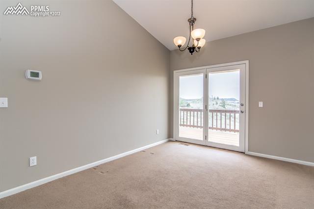 6110 Rabbit Ears Court Colorado Springs, CO 80919 - Photo 11 of 32 Dining Room with walk out to the deck
