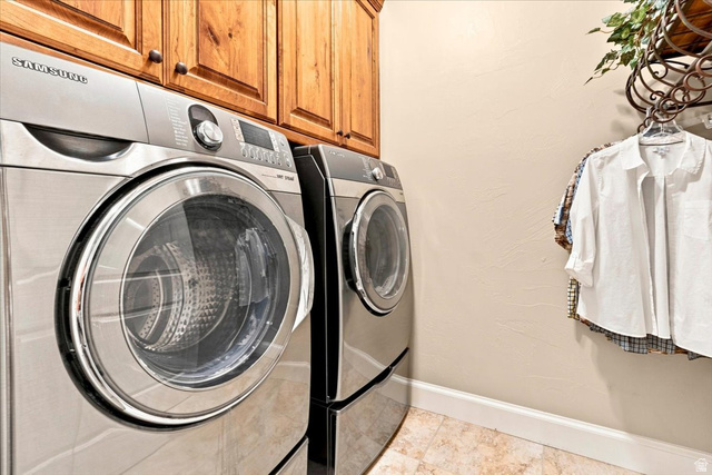 11290 South Southfield Road Mayfield, UT 84643 - Photo 61 of 103 Built-in wood cabinetry, full-size front-load washer and dryer, and tiled flooring