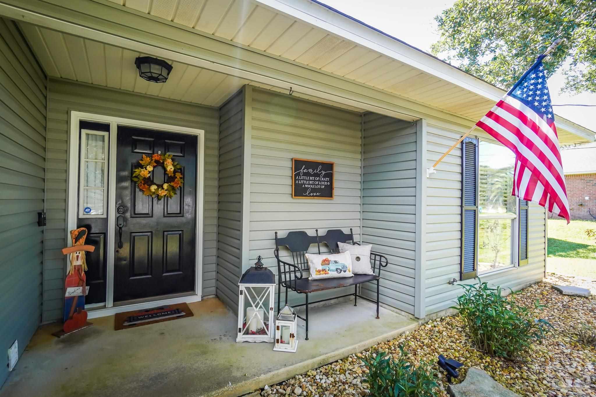 6545 Fern Street Navarre, FL 32566 - Photo 3 of 32 a view of a outdoor space with a patio and a couch
