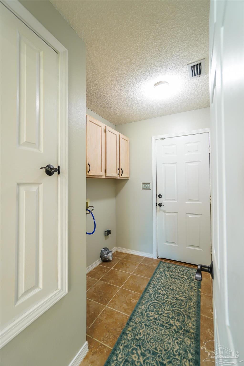 6545 Fern Street Navarre, FL 32566 - Photo 25 of 32 a bathroom with a granite countertop sink and a mirror