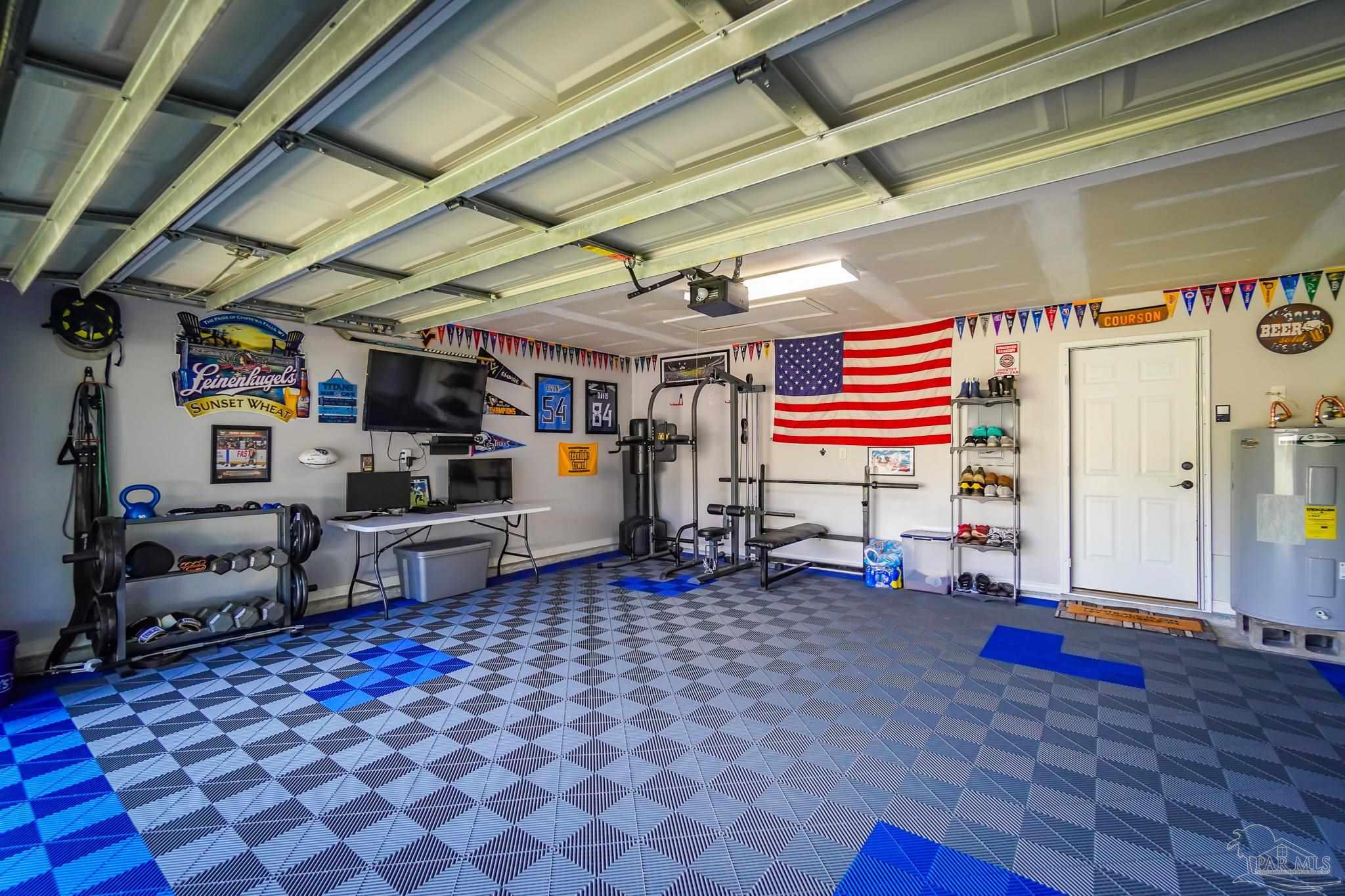 6545 Fern Street Navarre, FL 32566 - Photo 31 of 32 a living room with lots of furniture and fish tank