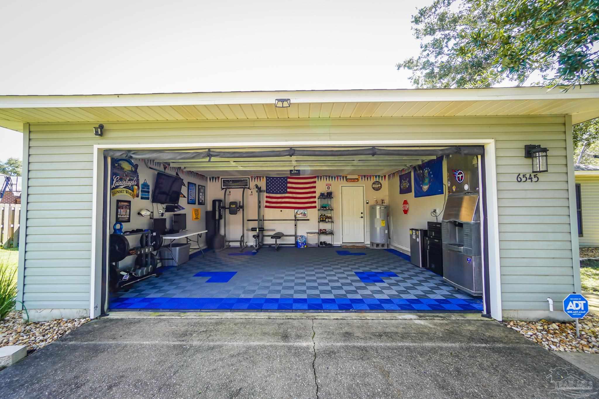 6545 Fern Street Navarre, FL 32566 - Photo 32 of 32 a view of a porch with a table and a chair