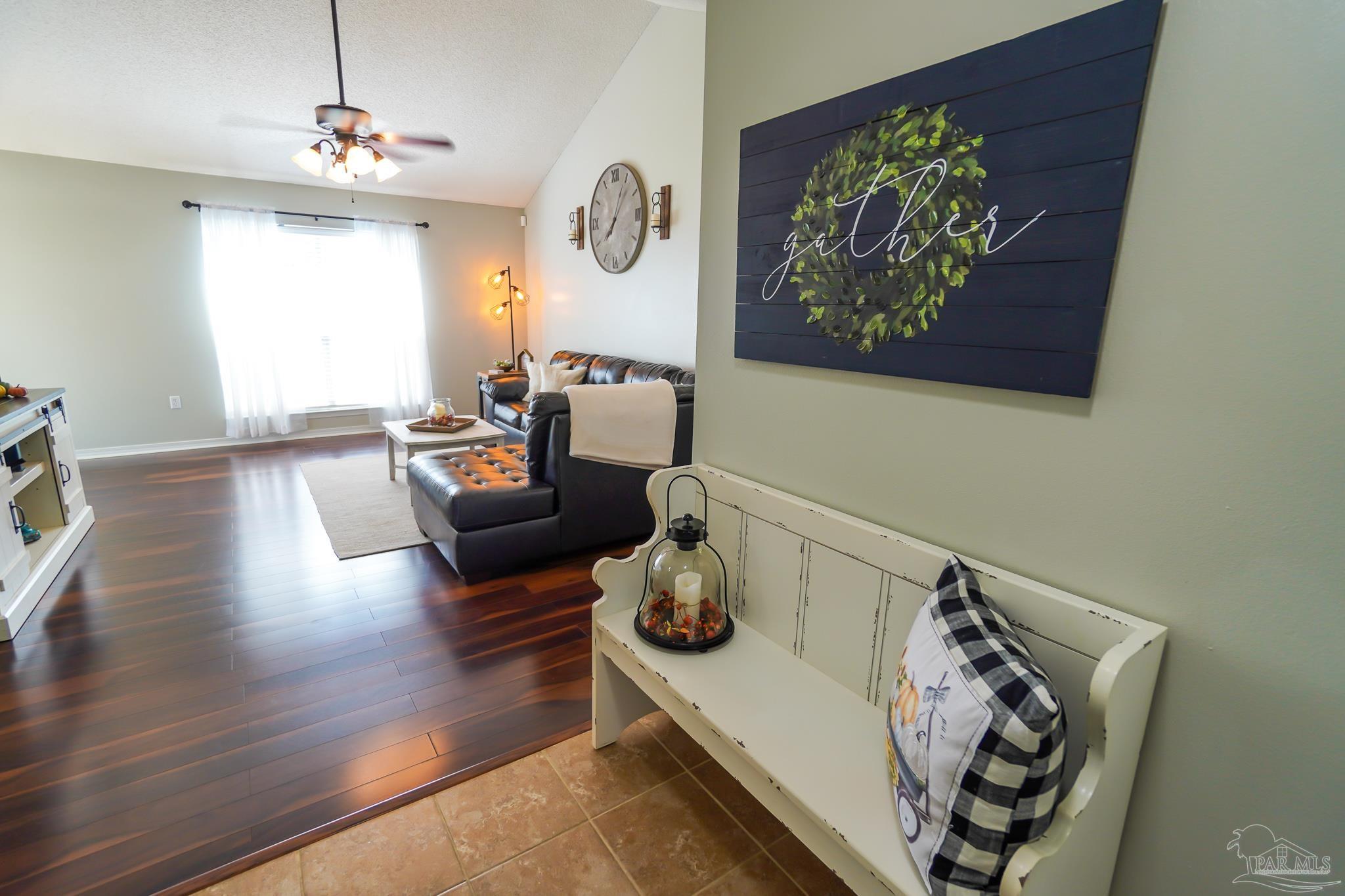 6545 Fern Street Navarre, FL 32566 - Photo 8 of 32 a living room with furniture and a window