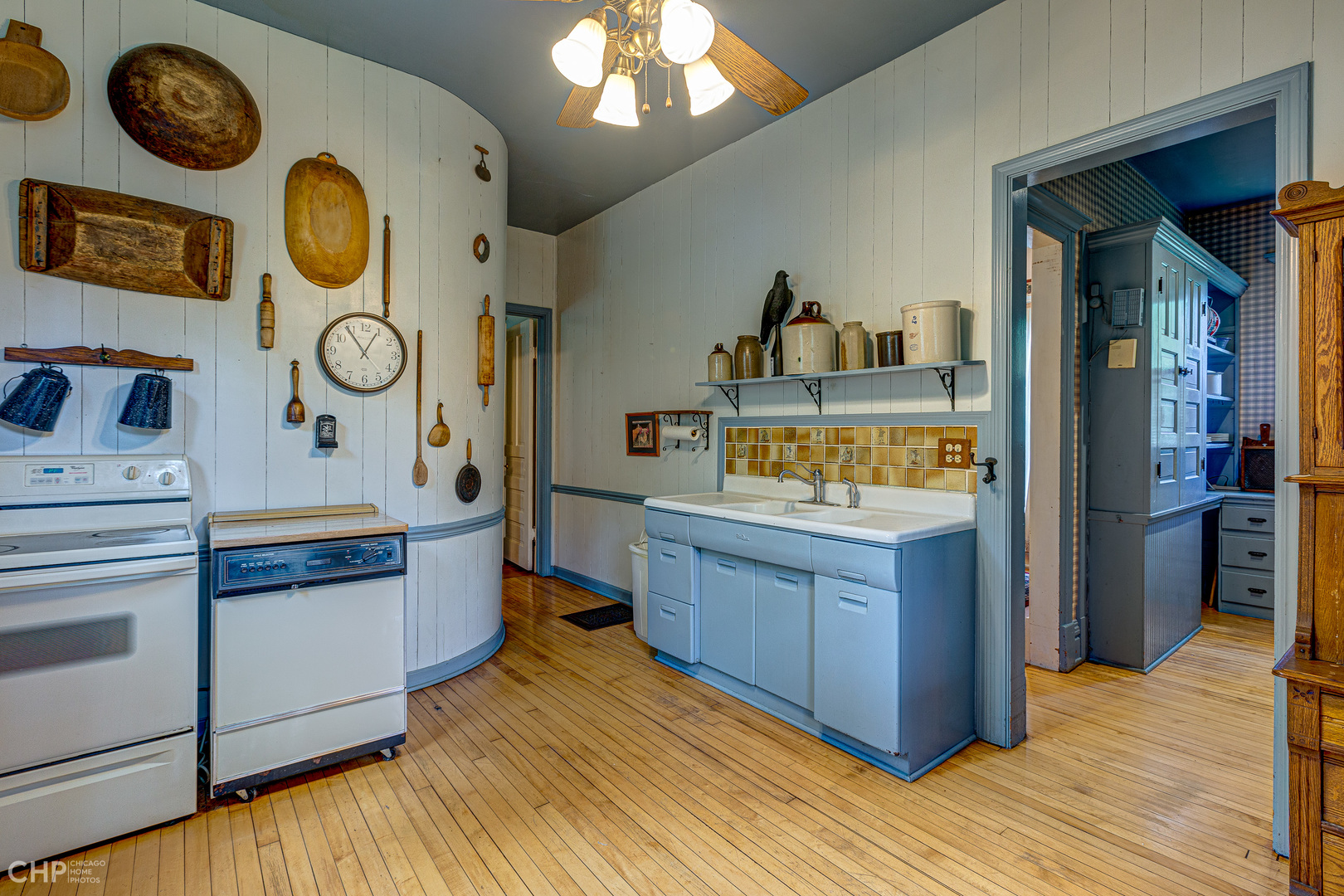 5725 Broadway Road Richmond, IL 60071 - Photo 13 of 26 a kitchen with stainless steel appliances granite countertop a stove and wooden floor