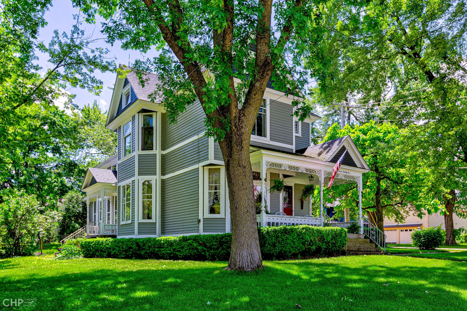 5725 Broadway Road Richmond, IL 60071 - Photo 2 of 26 a view of a brick house with a yard and large trees
