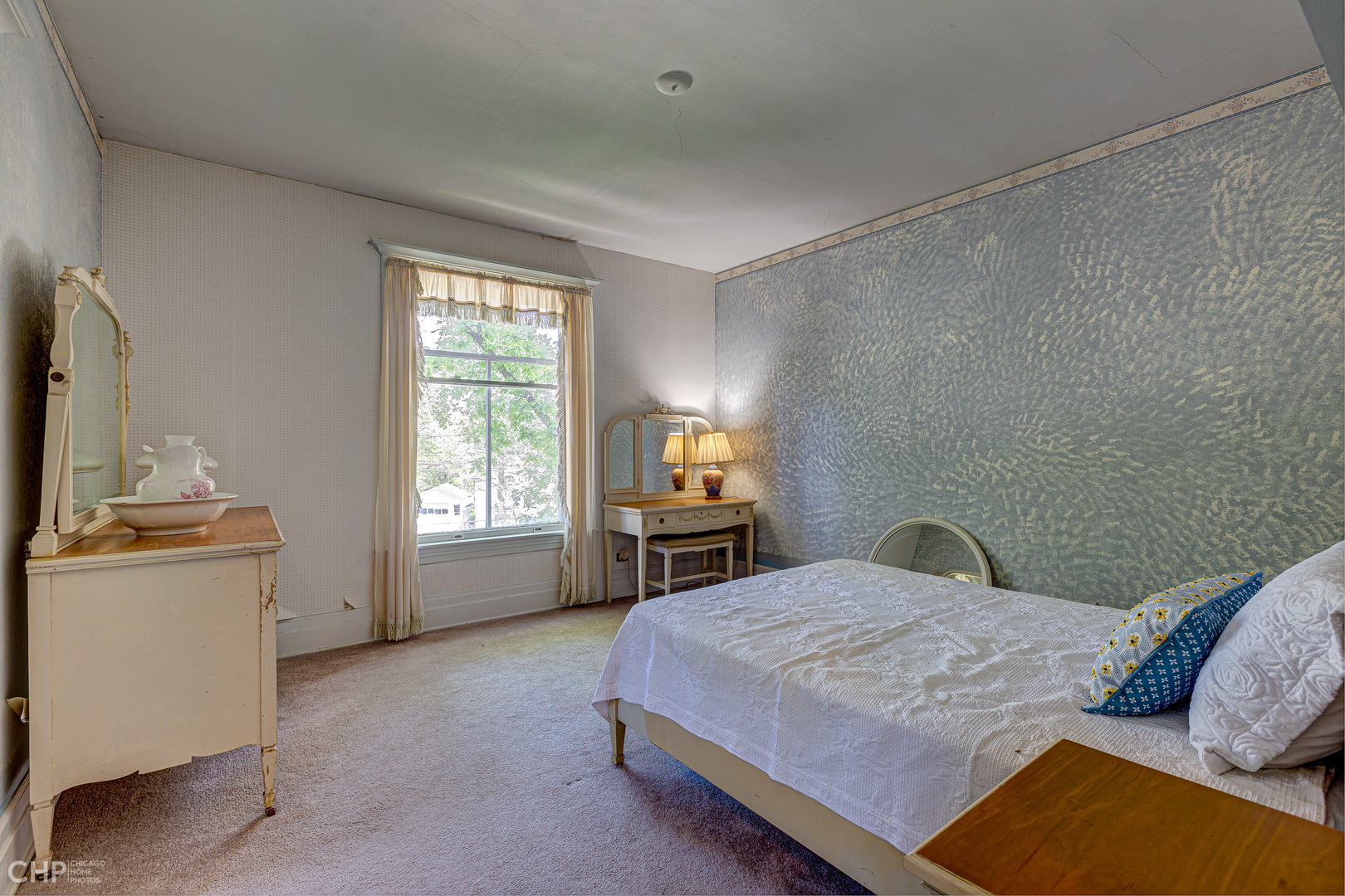 5725 Broadway Road Richmond, IL 60071 - Photo 21 of 26 a bedroom with a bed and a flat tv screen on the wall