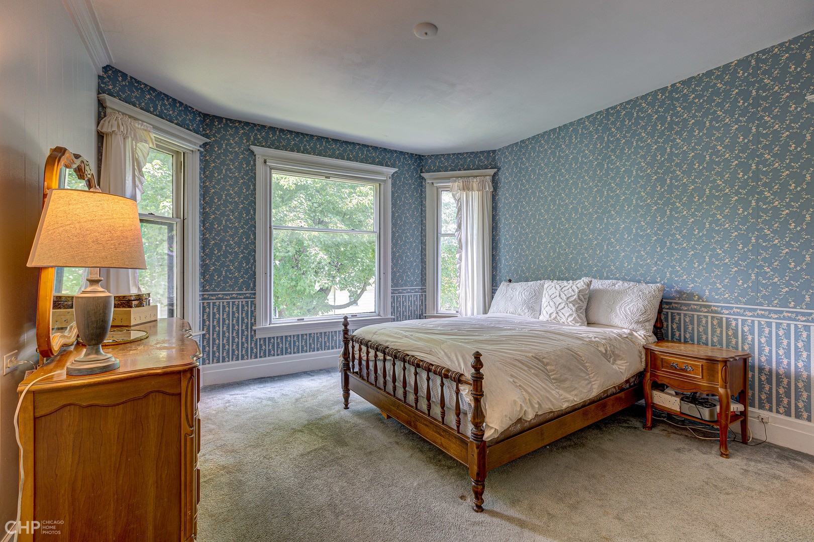 5725 Broadway Road Richmond, IL 60071 - Photo 22 of 26 a bedroom with a bed and a lamp on table