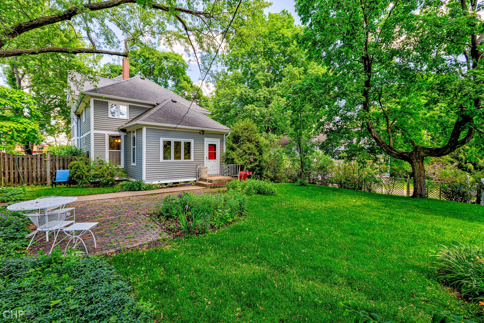 5725 Broadway Road Richmond, IL 60071 - Photo 3 of 26 a front view of a house with garden