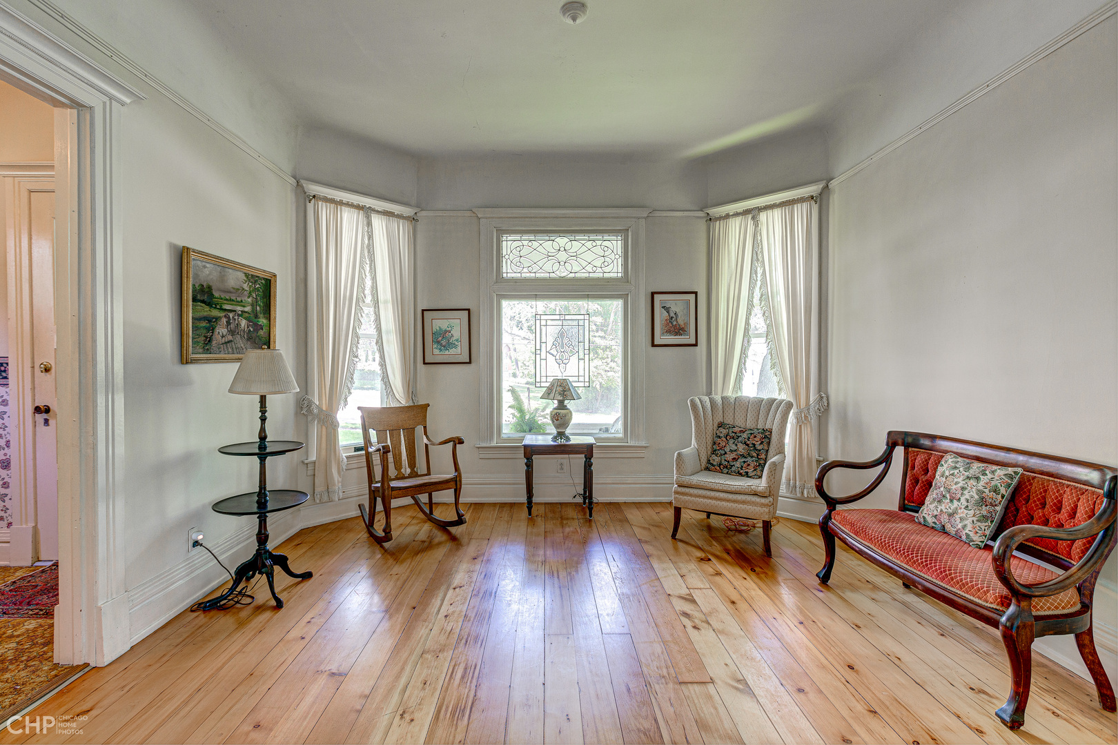 5725 Broadway Road Richmond, IL 60071 - Photo 8 of 26 a living room with furniture and a wooden floor