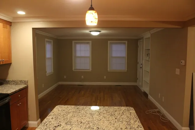 a view of hallway with granite countertop furniture and a rug