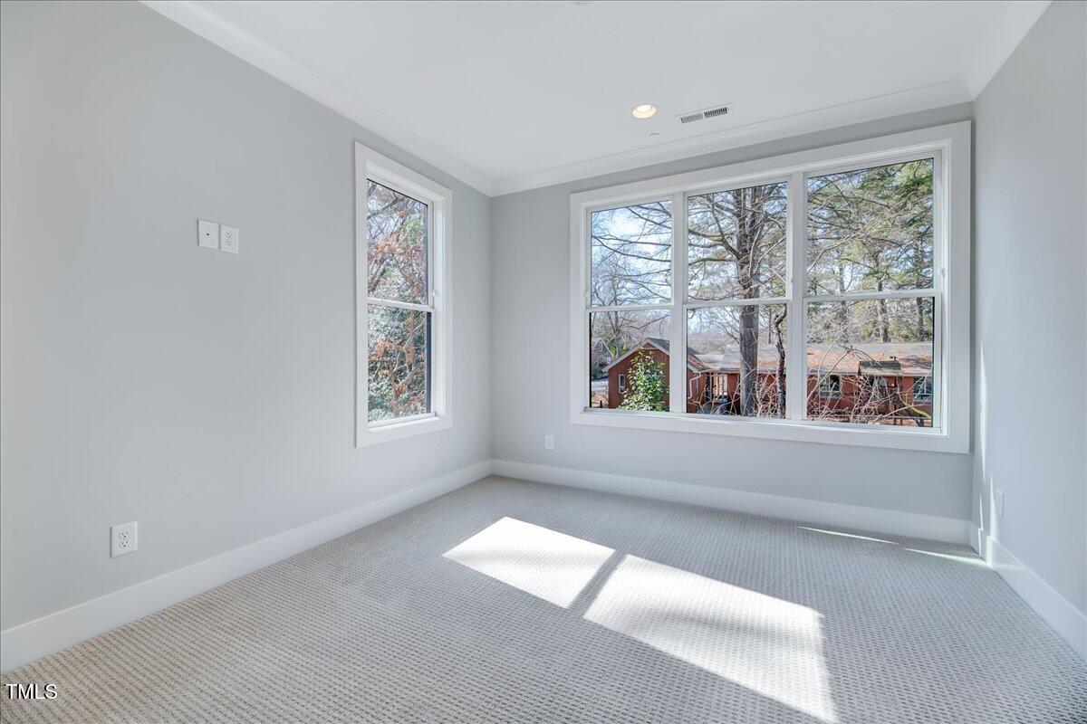 811 Maple Berry Lane, Unit 106 Raleigh, NC 27607 - Photo 21 of 30 a view of empty room with window