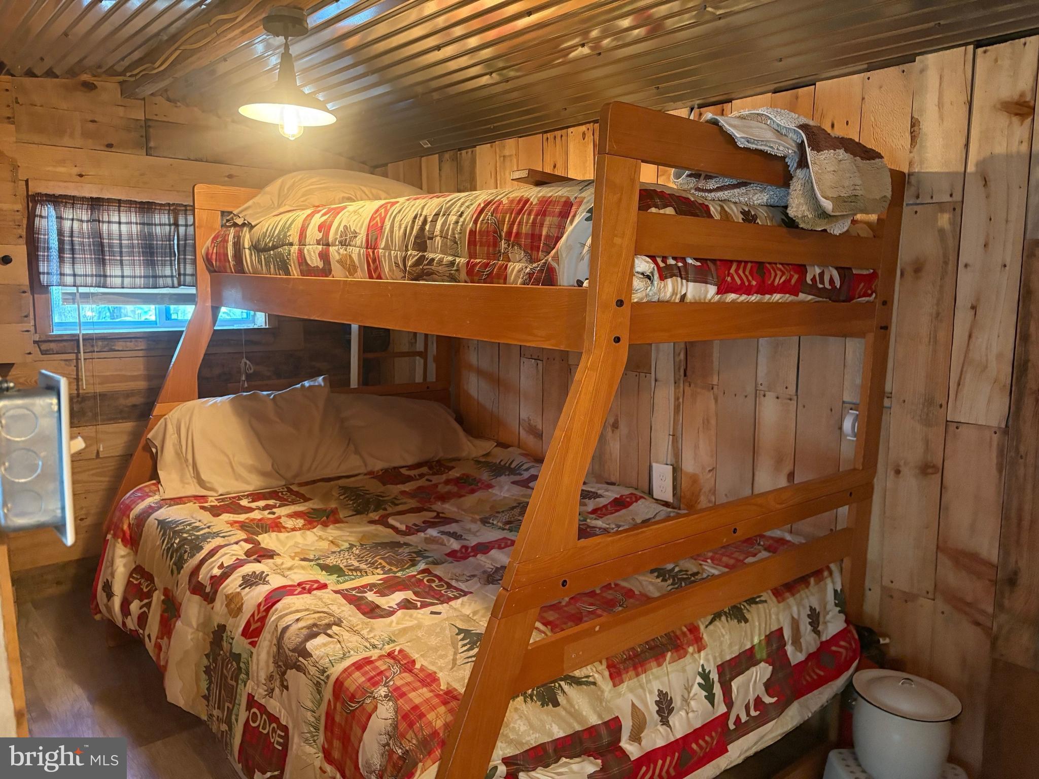 465 Miltonberger Road Orrtanna, PA 17353 - Photo 12 of 13 a bed sitting in a bedroom next to a window