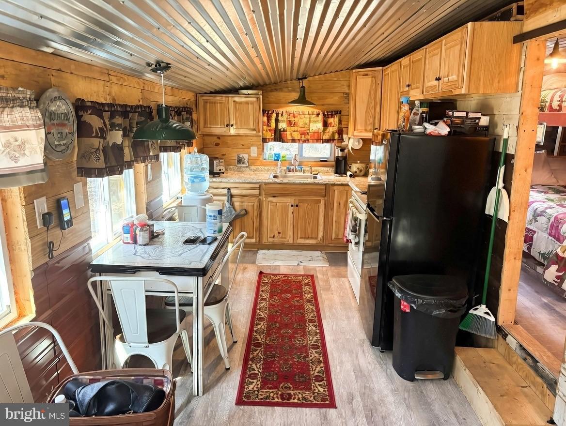 465 Miltonberger Road Orrtanna, PA 17353 - Photo 7 of 13 a kitchen with a refrigerator and a stove