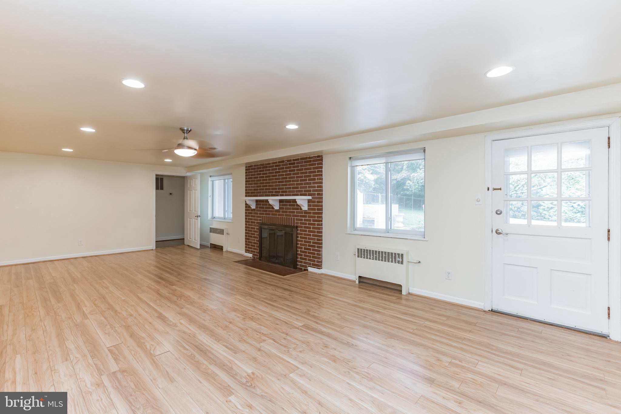 2100 Marymont Road Silver Spring, MD 20906 - Photo 29 of 37 Recreation room with fireplace & rear exit