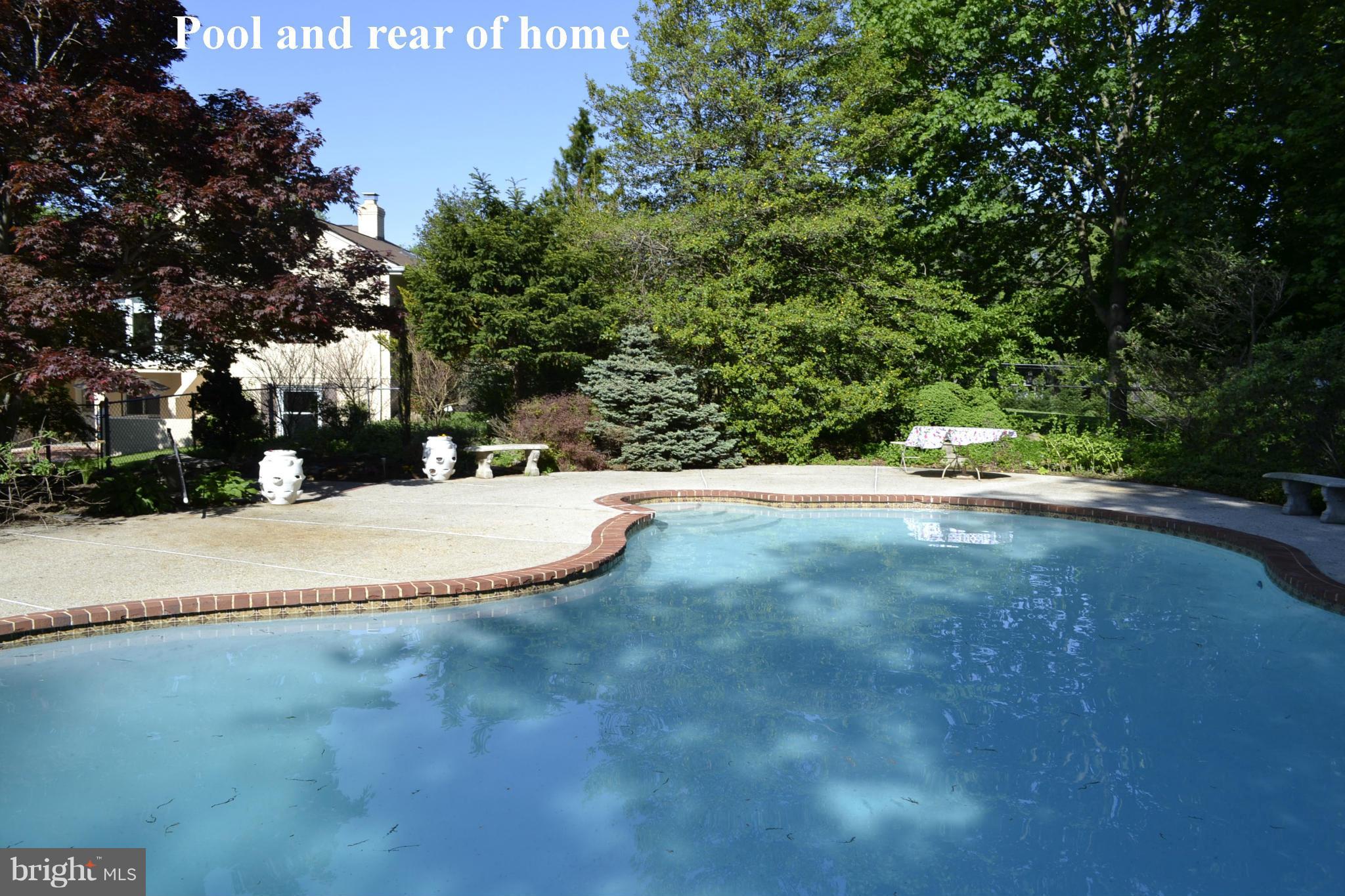 2100 Marymont Road Silver Spring, MD 20906 - Photo 31 of 37 View of pool and rear of home in the summer