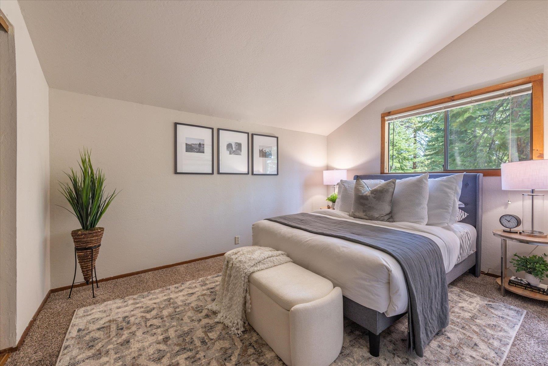 325 North Ridge Road Carnelian Bay, CA 96140 - Photo 16 of 22 a bed room with a bed and a potted plant