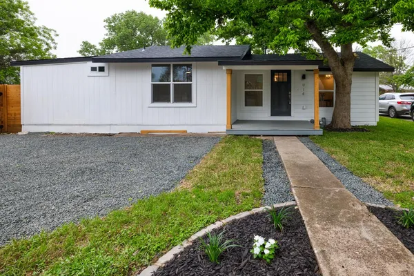 front view of a house with a yard