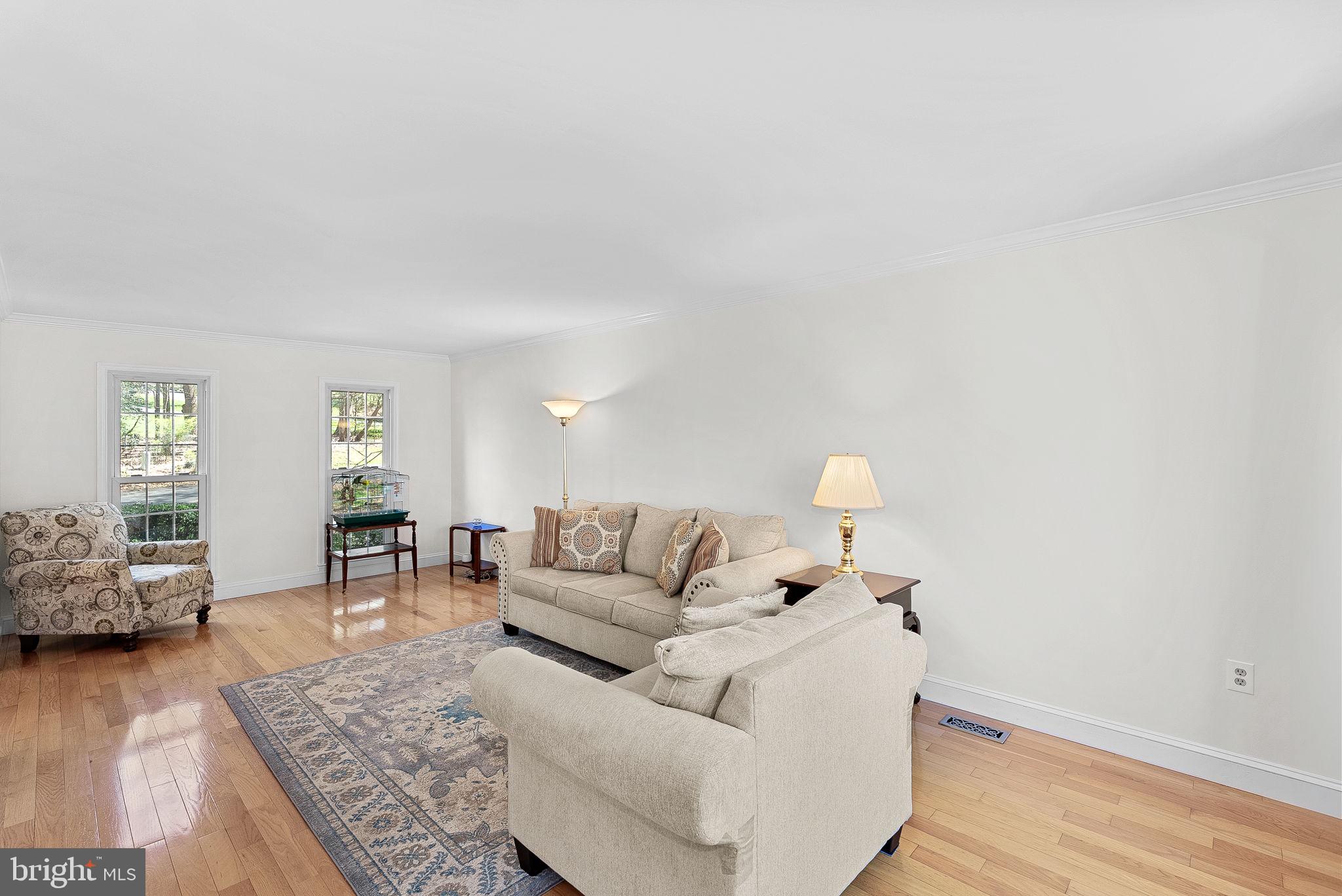 2804 Bree Hill Road Oakton, VA 22124 - Photo 15 of 46 a living room with furniture and wooden floor