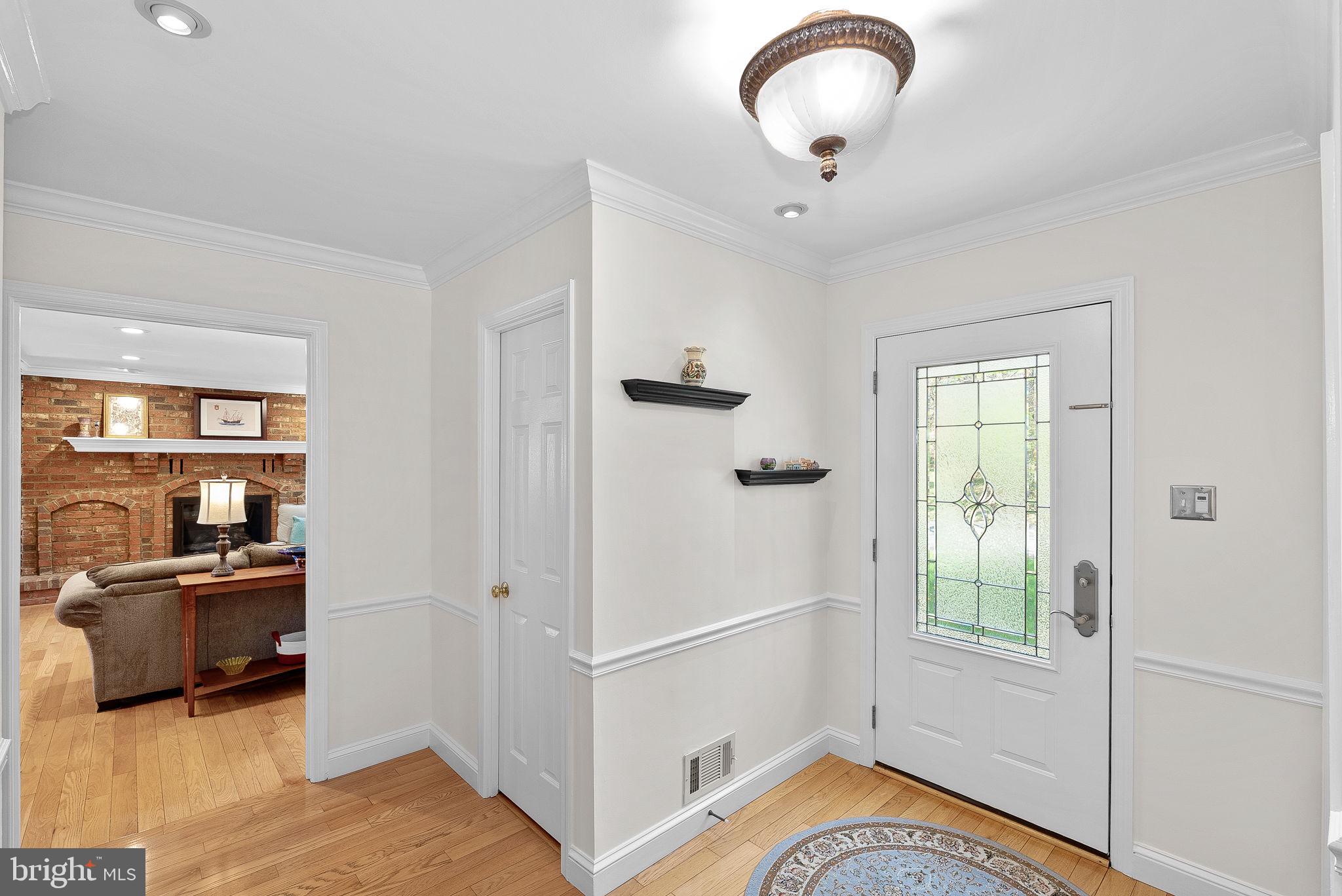 2804 Bree Hill Road Oakton, VA 22124 - Photo 19 of 46 a view of a hardwood floor and windows in a room