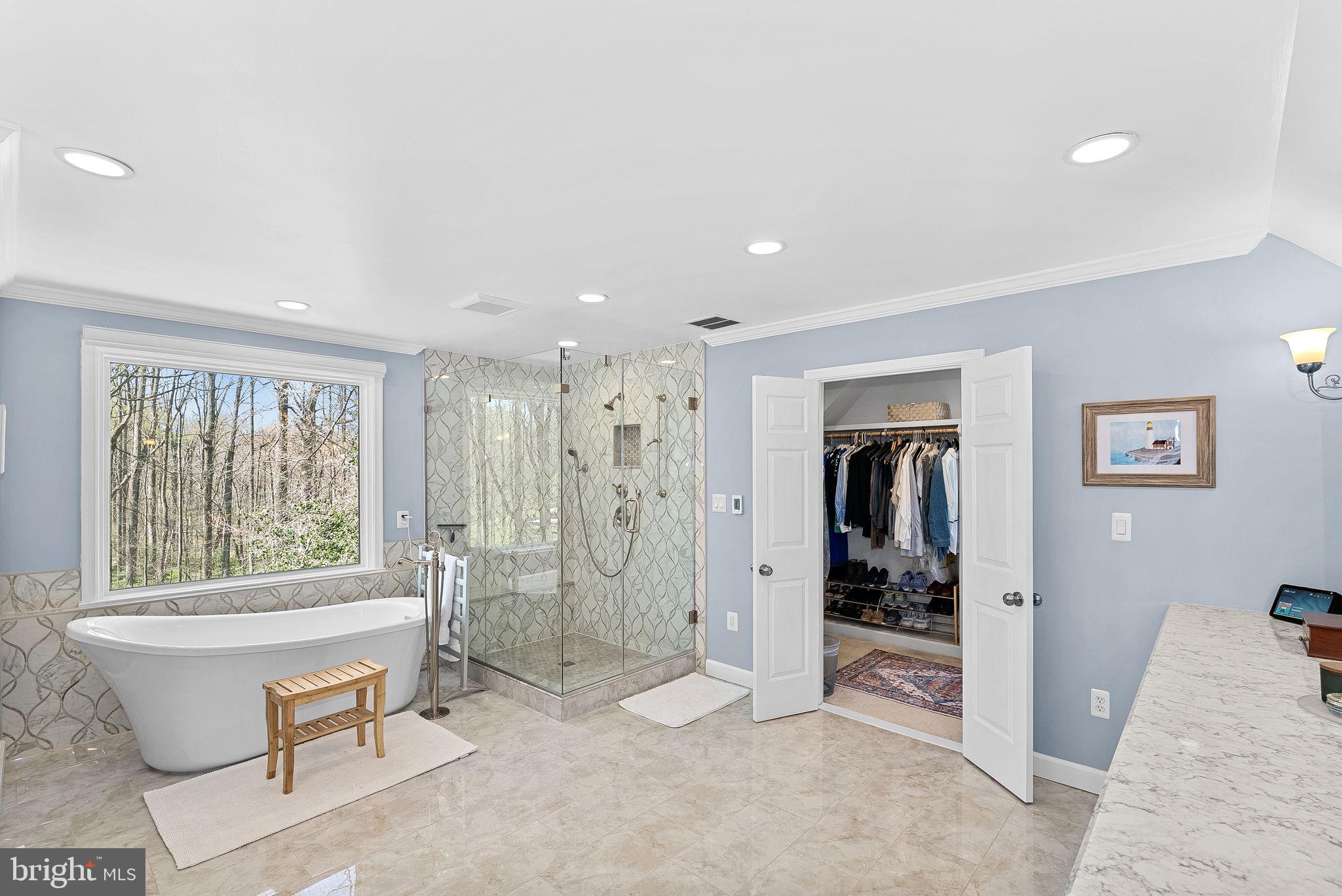 2804 Bree Hill Road Oakton, VA 22124 - Photo 25 of 46 a spacious bathroom with a double vanity sink and a toilet