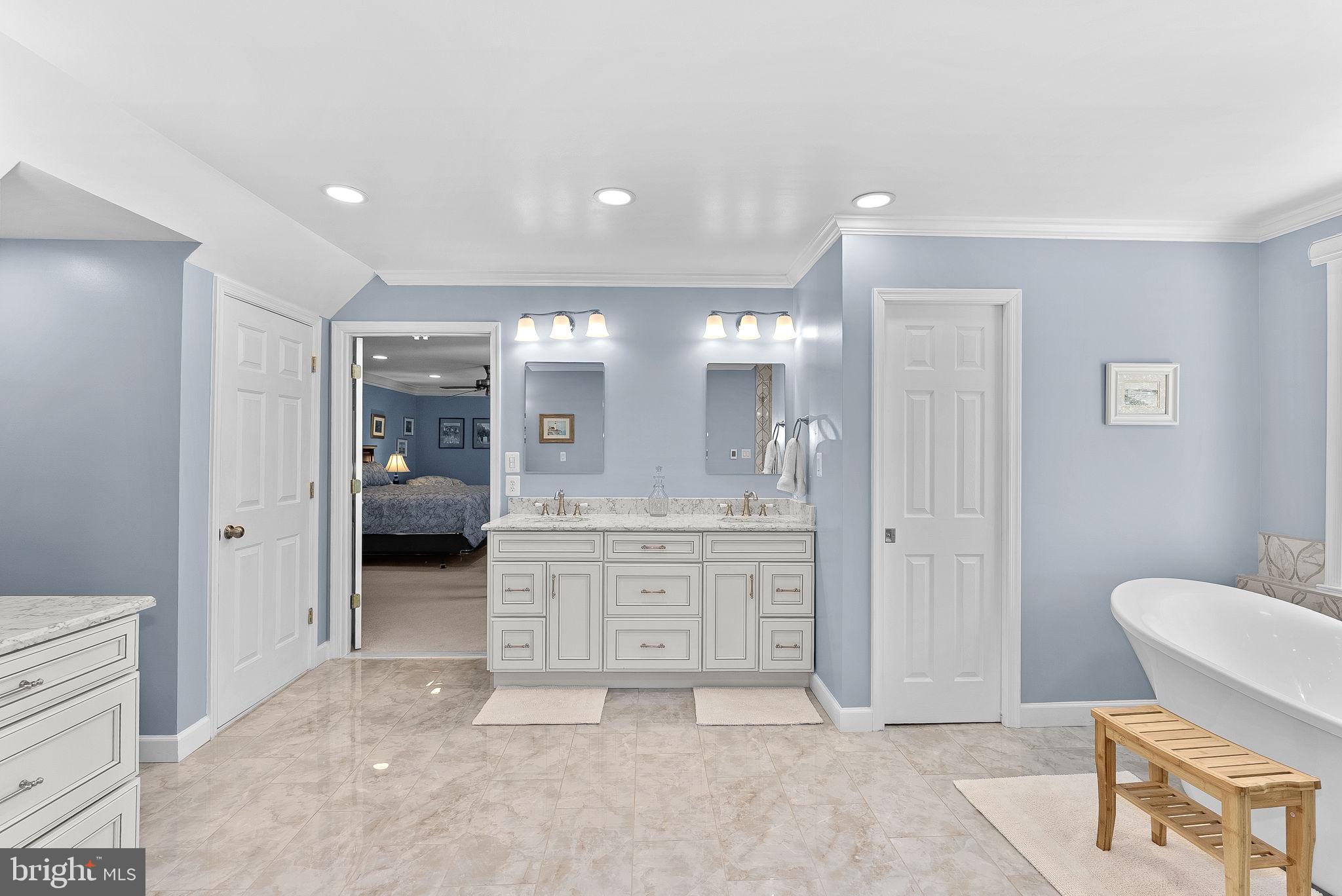 2804 Bree Hill Road Oakton, VA 22124 - Photo 27 of 46 a spacious bathroom with a granite countertop sink a toilet and a shower