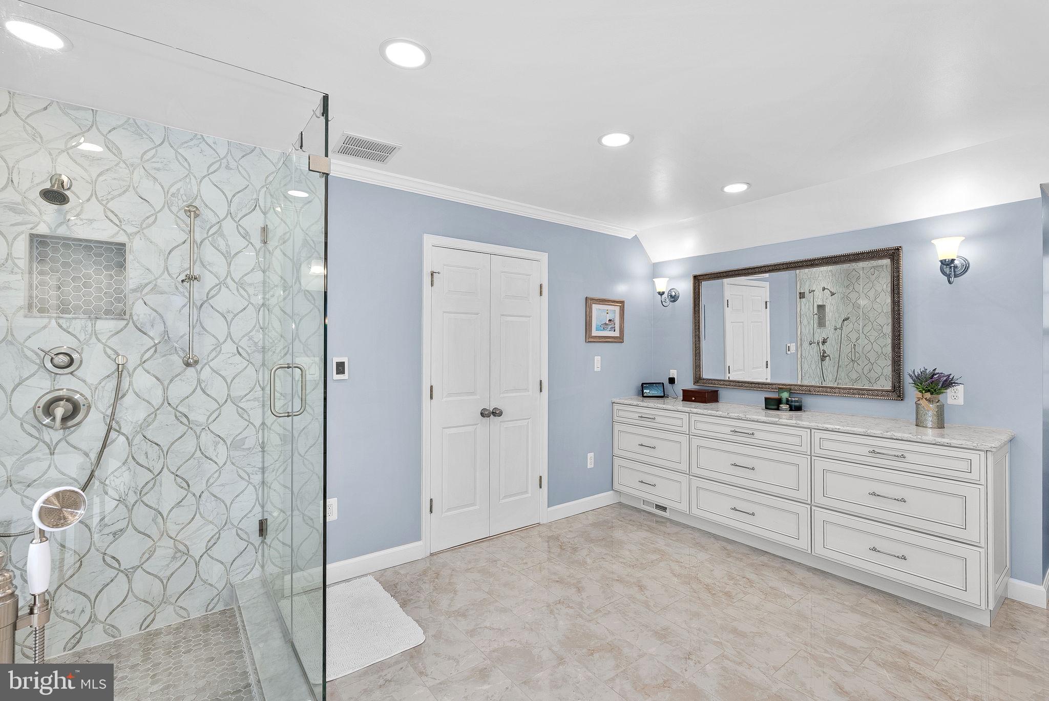 2804 Bree Hill Road Oakton, VA 22124 - Photo 28 of 46 a bathroom with a double vanity sink mirror and shower