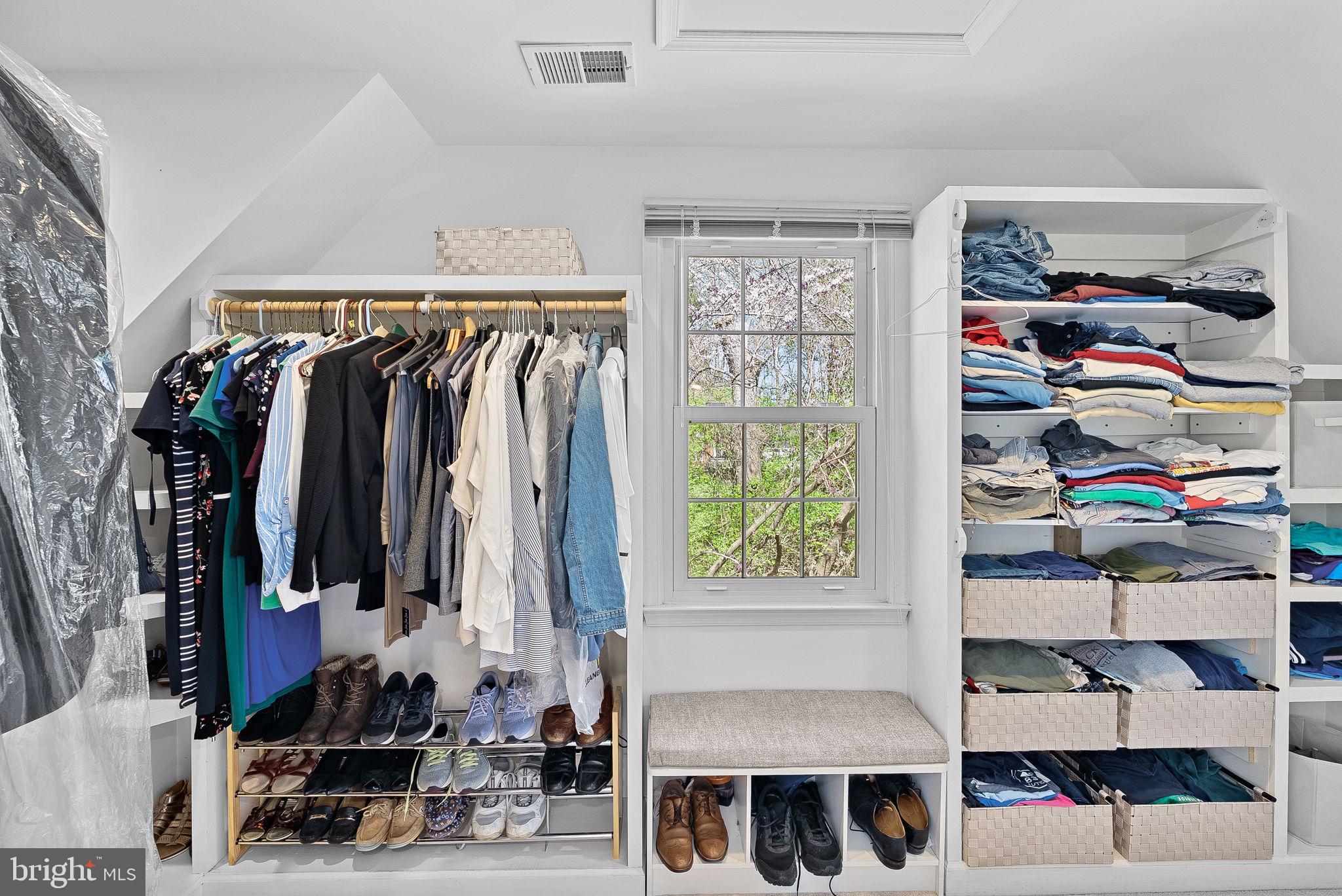 2804 Bree Hill Road Oakton, VA 22124 - Photo 29 of 46 a view of walk in closet with clothes and shoes