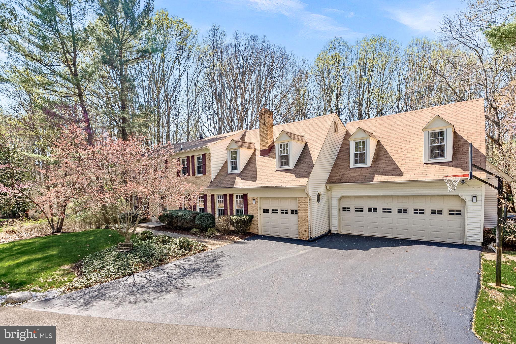 2804 Bree Hill Road Oakton, VA 22124 - Photo 3 of 46 a view of a building with a yard and trees