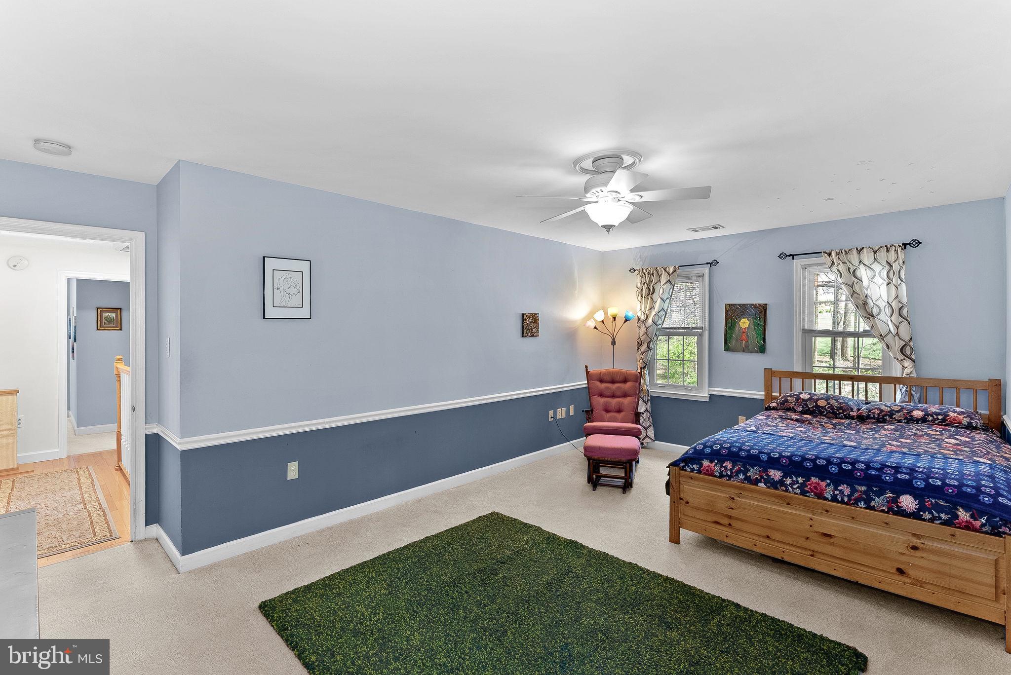 2804 Bree Hill Road Oakton, VA 22124 - Photo 33 of 46 a bedroom with a bed and a chandelier