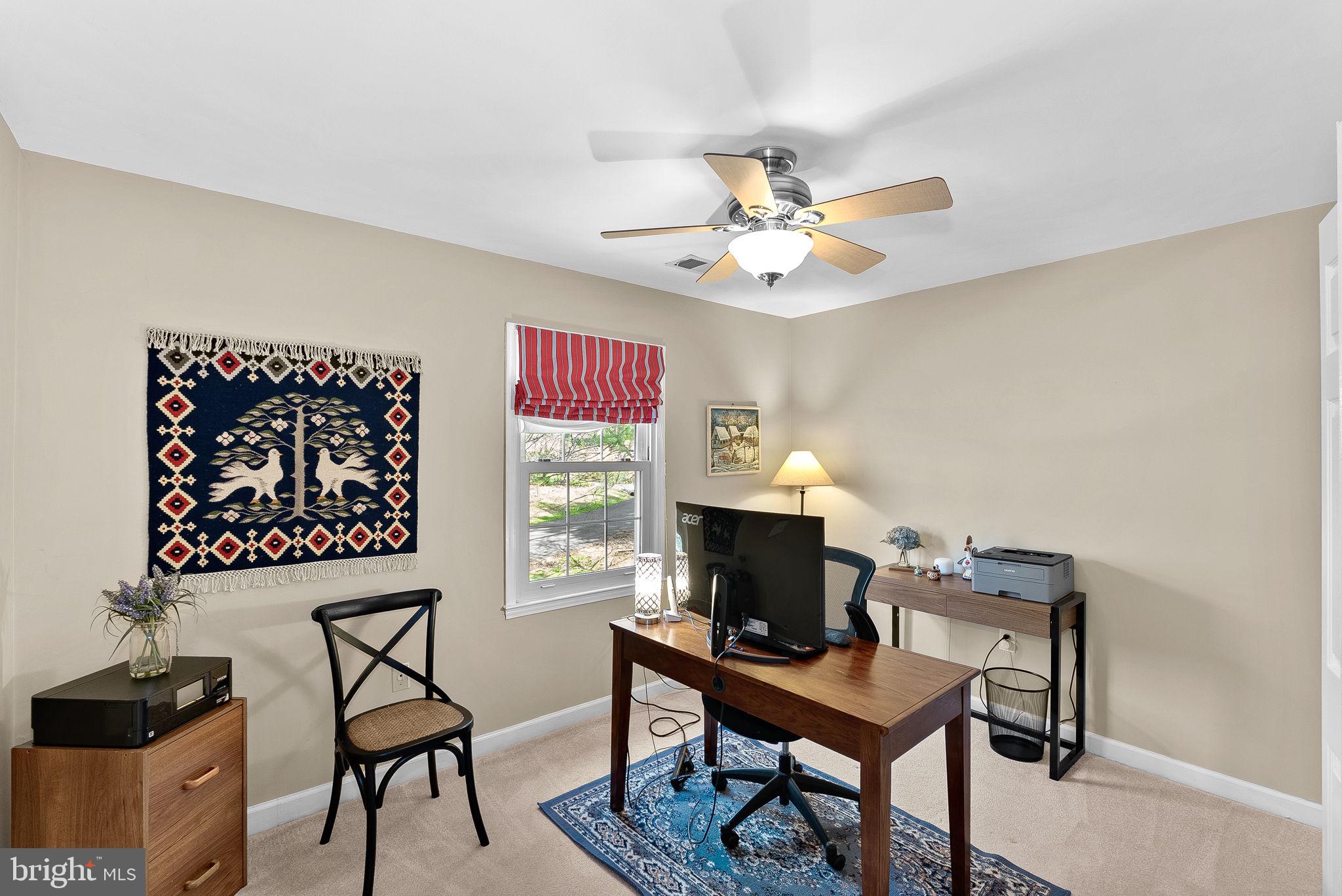 2804 Bree Hill Road Oakton, VA 22124 - Photo 34 of 46 a view of a workspace with furniture and a window