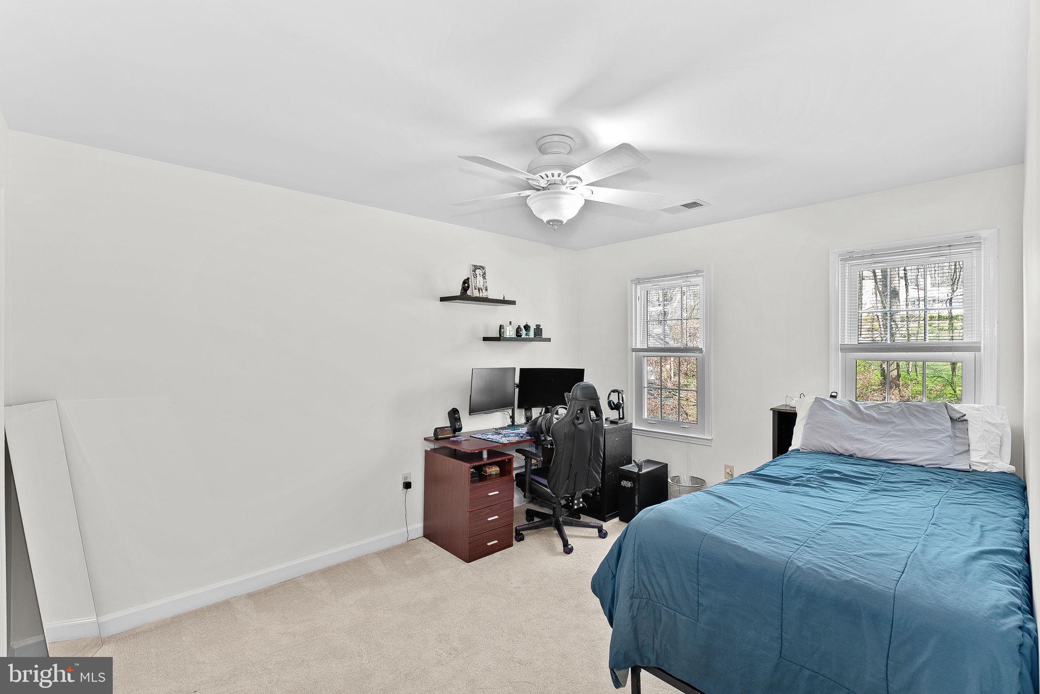 2804 Bree Hill Road Oakton, VA 22124 - Photo 35 of 46 a bed room with furniture and a window