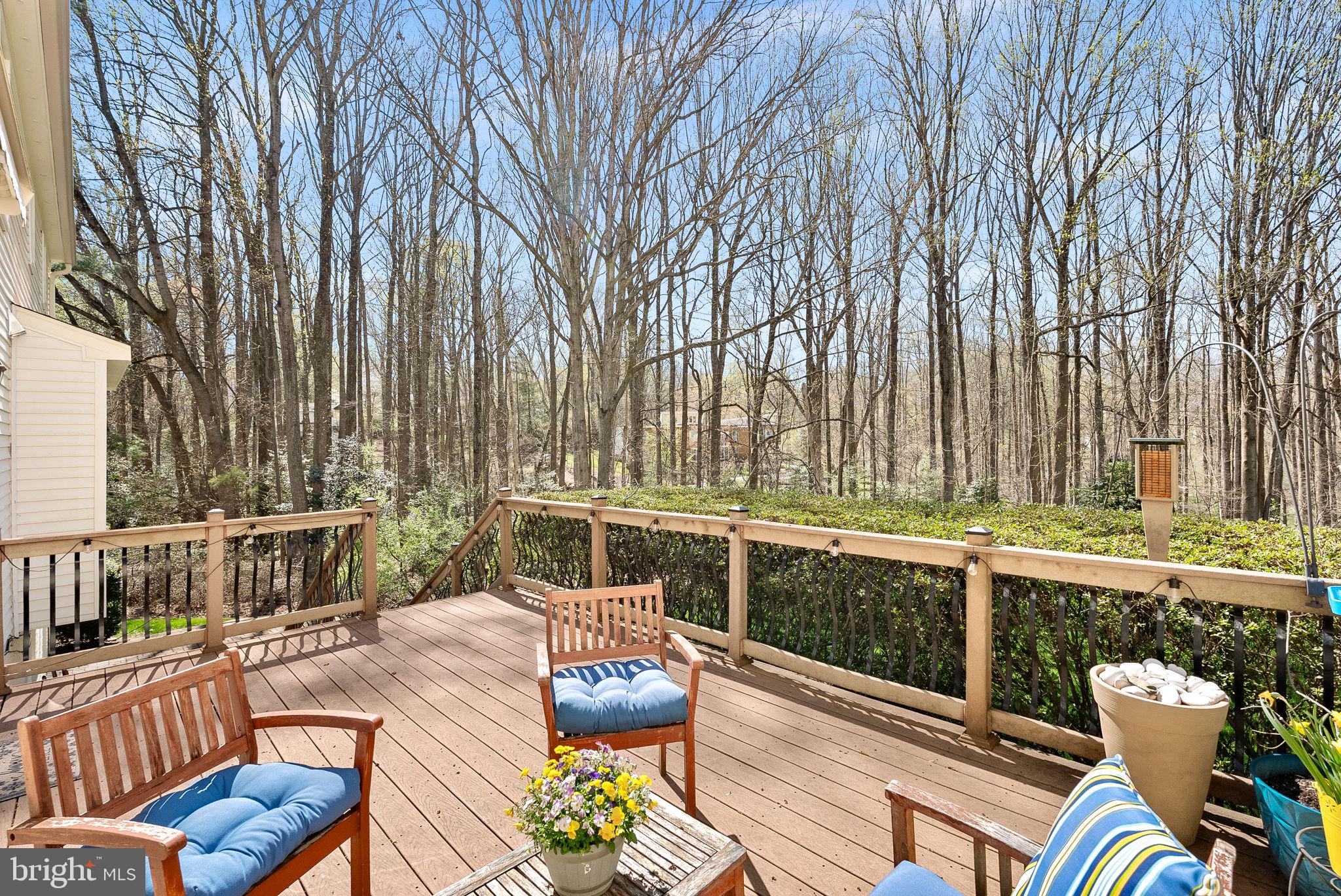 2804 Bree Hill Road Oakton, VA 22124 - Photo 43 of 46 a view of a patio with couches table and chairs with wooden floor and fence