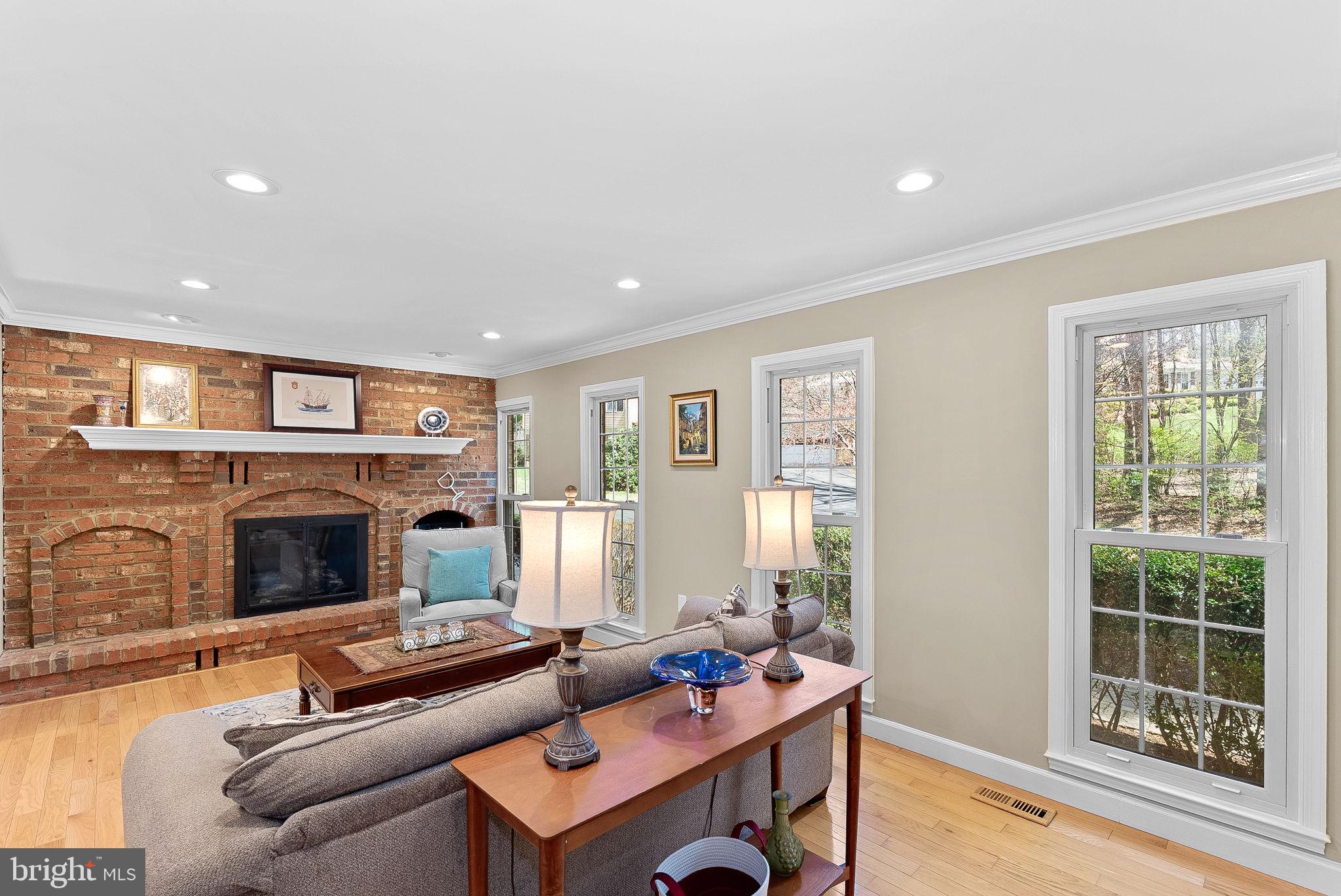 2804 Bree Hill Road Oakton, VA 22124 - Photo 10 of 46 a living room with furniture and a fireplace