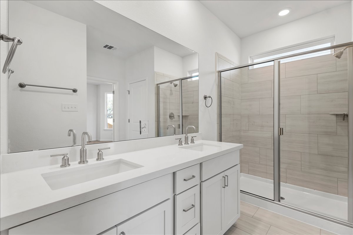 133 Grn Knl Lane Georgetown, TX 78628 - Photo 21 of 31 a bathroom with a sink double vanity and shower