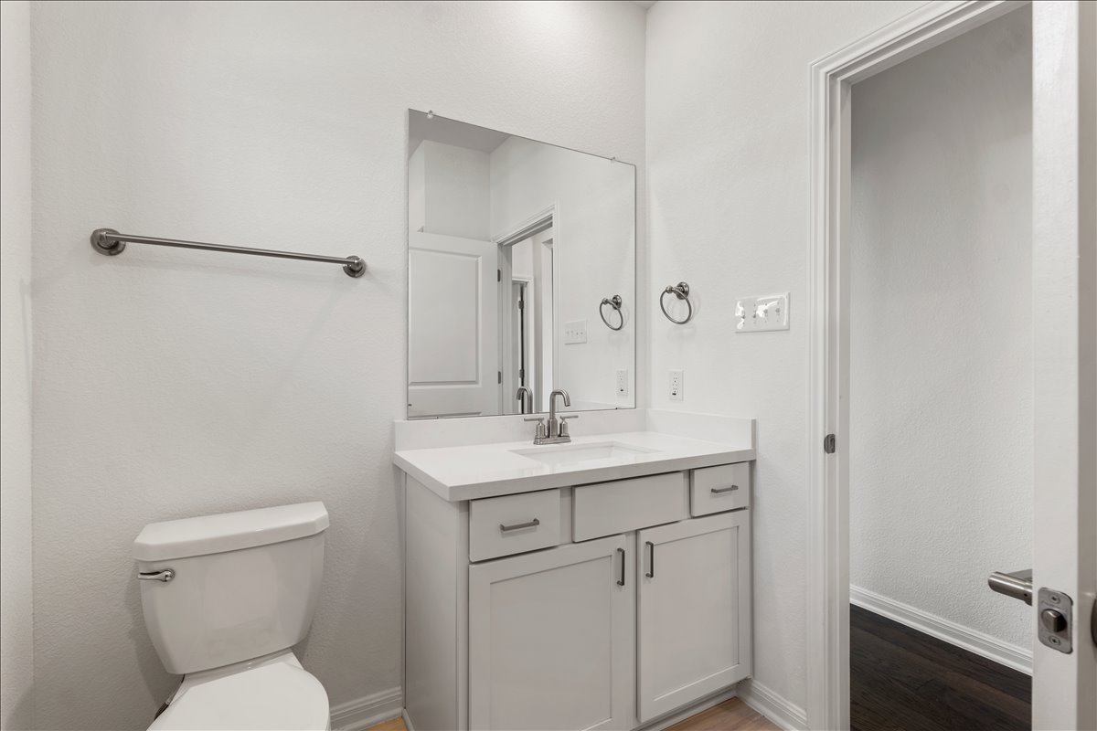 133 Grn Knl Lane Georgetown, TX 78628 - Photo 27 of 31 a bathroom with a toilet sink and mirror
