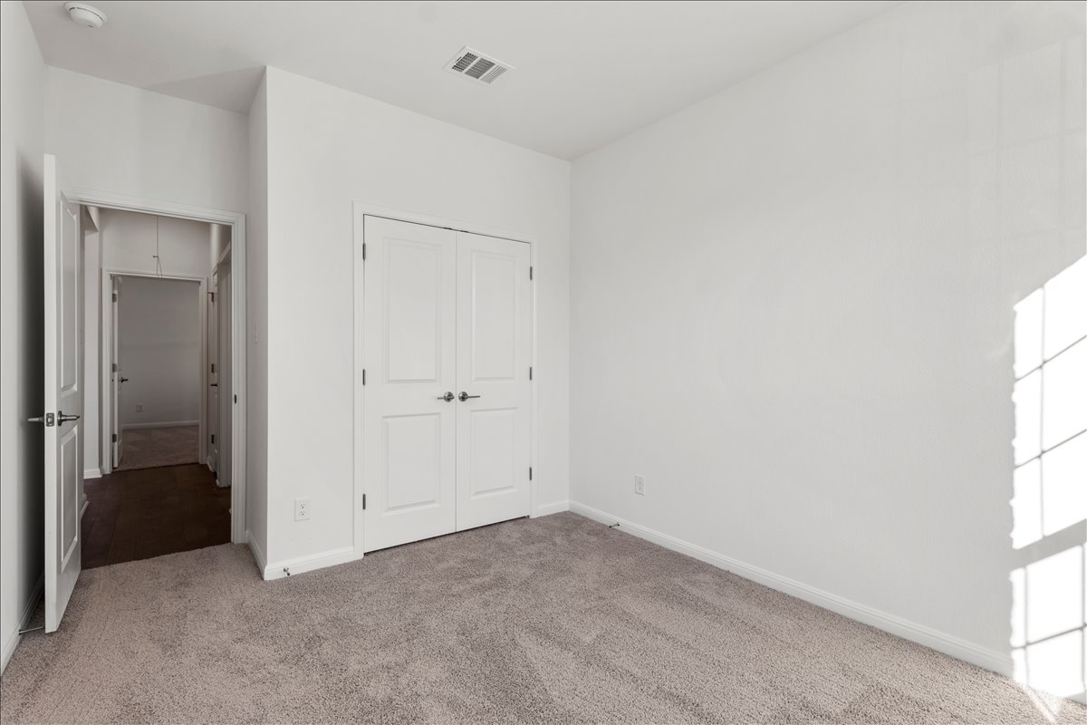 133 Grn Knl Lane Georgetown, TX 78628 - Photo 30 of 31 an empty room with windows and closet