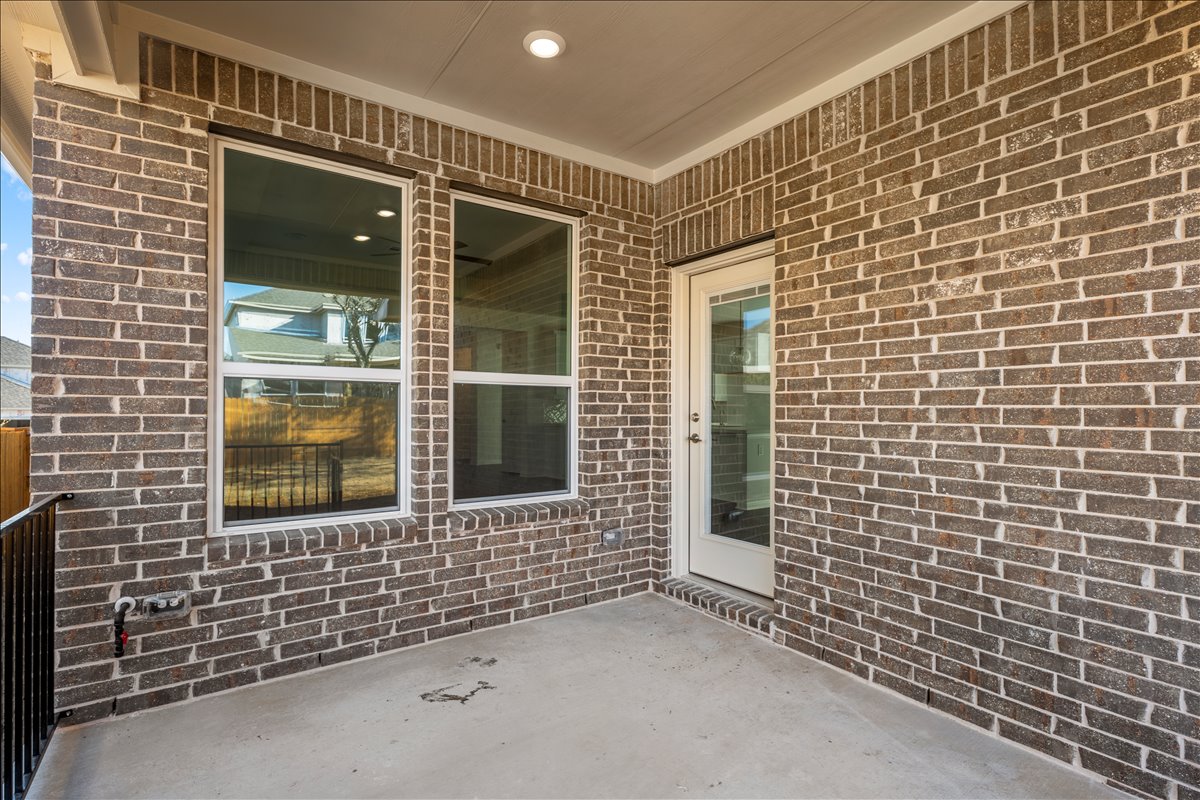133 Grn Knl Lane Georgetown, TX 78628 - Photo 8 of 31 a view of a brick house with a window