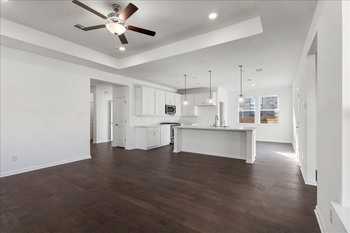 133 Grn Knl Lane Georgetown, TX 78628 - Photo 10 of 31 a view of kitchen with wooden floor and window