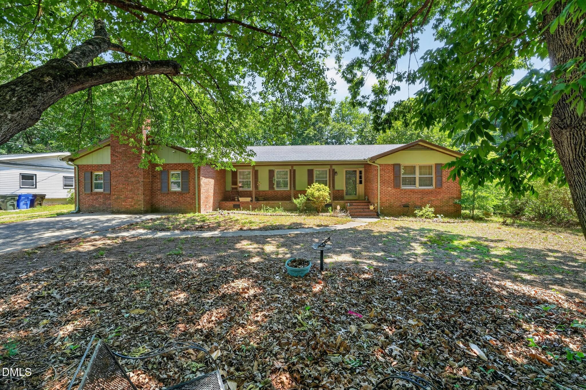 1034 Jerome Road Durham, NC 27713 - Photo 2 of 35 a front view of a house with garden
