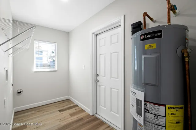 a view of an entryway with wooden floor