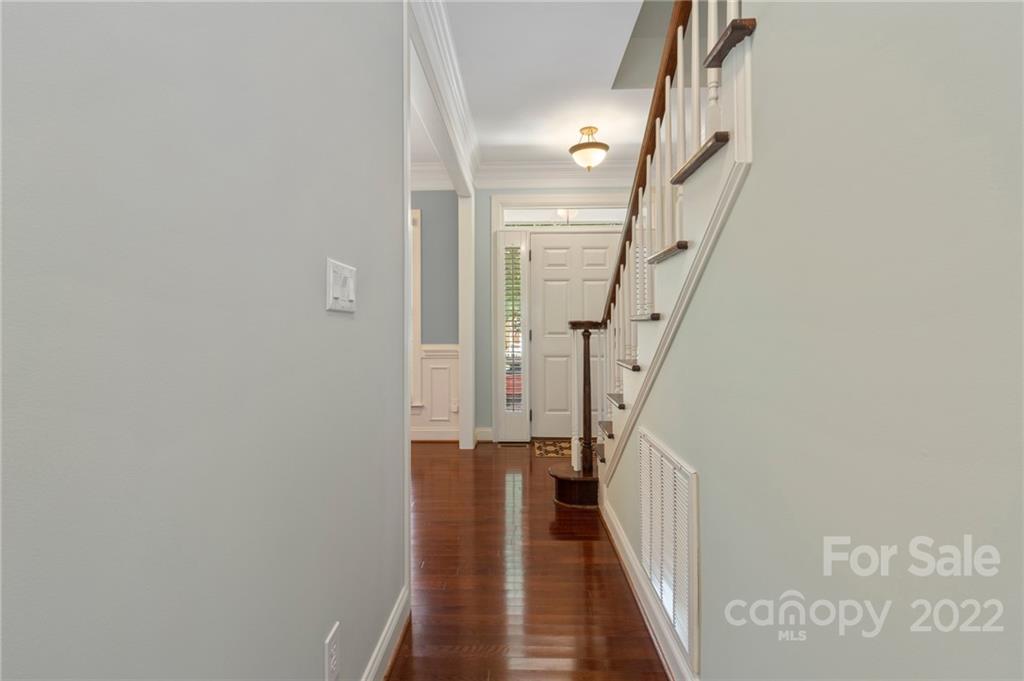 389 Third Baxter Street Fort Mill, SC 29708 - Photo 11 of 48 a view of a hallway with wooden floor and staircase