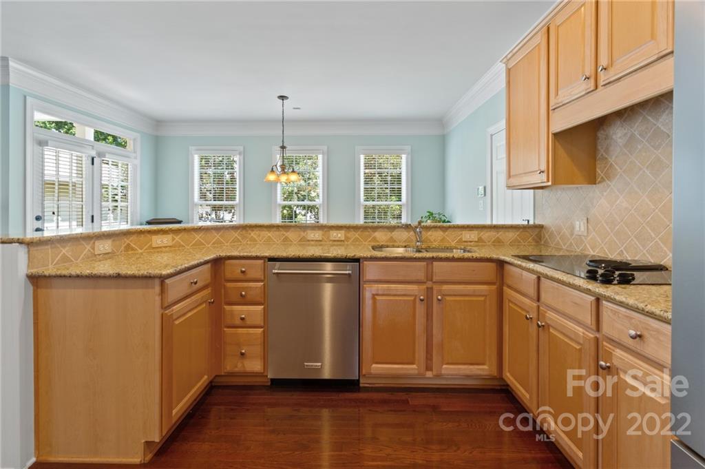 389 Third Baxter Street Fort Mill, SC 29708 - Photo 14 of 48 a kitchen with stainless steel appliances granite countertop a stove a sink and a microwave