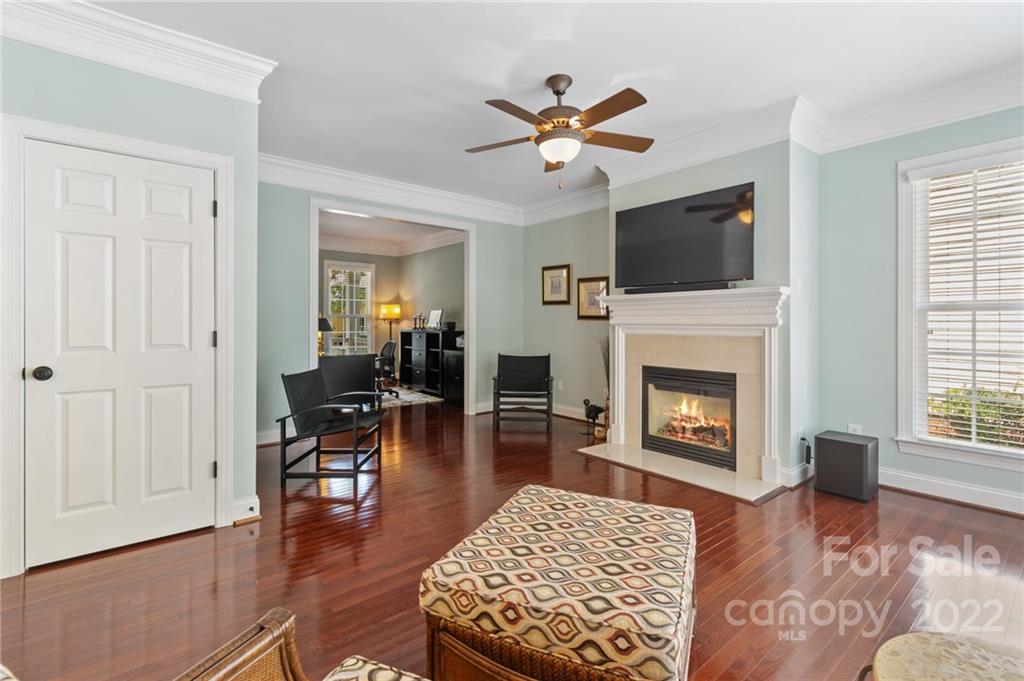 389 Third Baxter Street Fort Mill, SC 29708 - Photo 21 of 48 a living room with furniture a flat screen tv and a fireplace