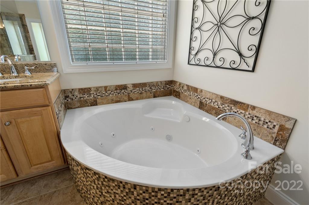 389 Third Baxter Street Fort Mill, SC 29708 - Photo 33 of 48 a bathroom with a bathtub and a window