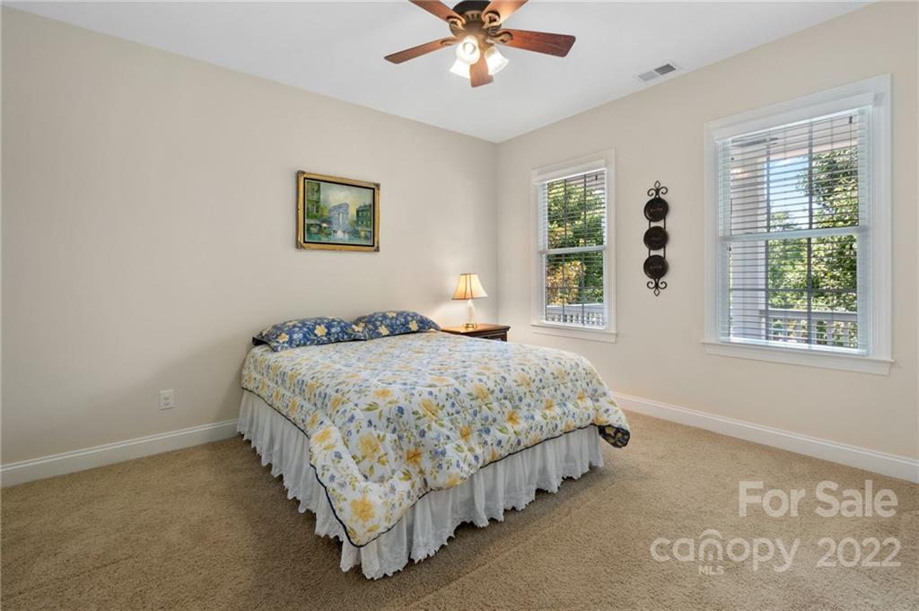 389 Third Baxter Street Fort Mill, SC 29708 - Photo 37 of 48 a bedroom with a bed and a window