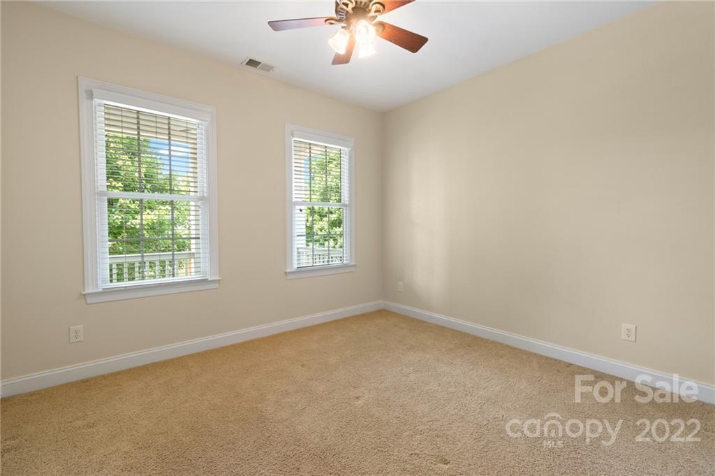 389 Third Baxter Street Fort Mill, SC 29708 - Photo 38 of 48 an empty room with a window and a fan